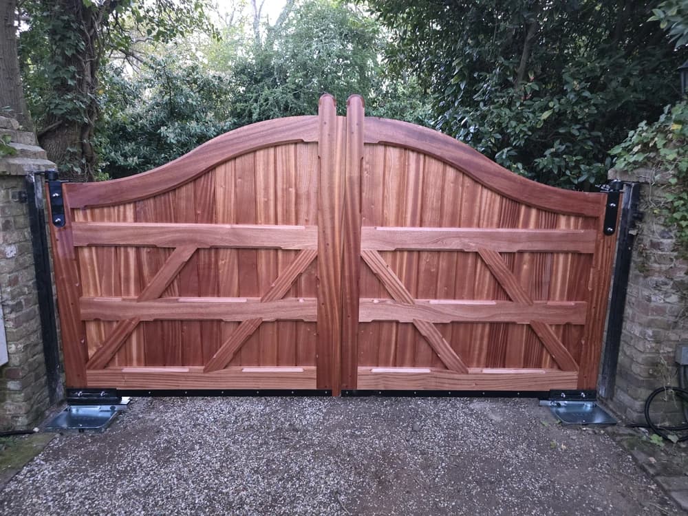 Framed and braced hardwood swan-neck double swing gates