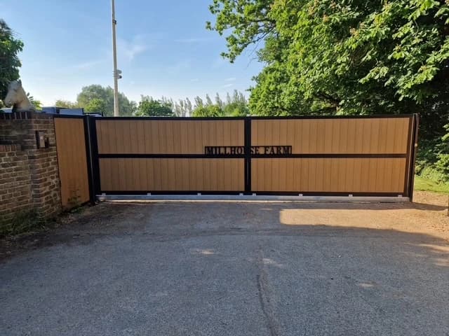 Oak-effect composite cantilever sliding gate at a mill house farm