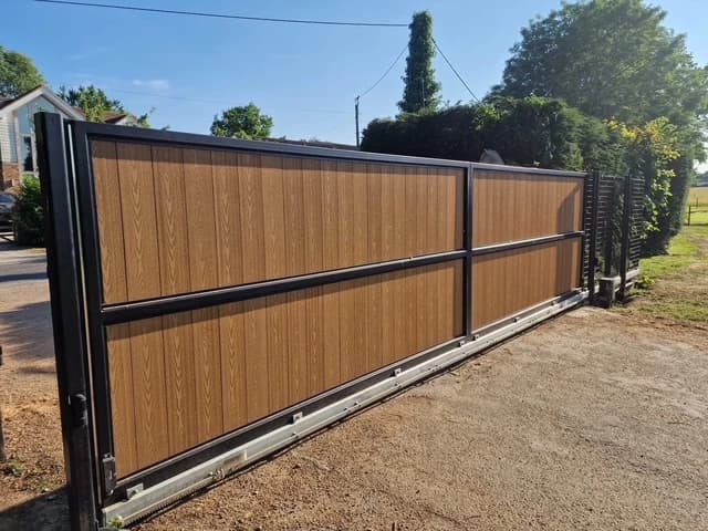 Track and roller detail on a composite cantilever sliding gate