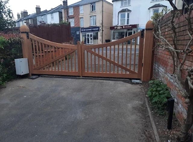 Hardwood slatted curved-top double swing gates